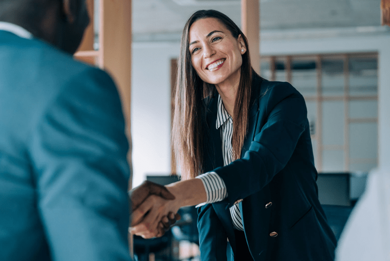 two asian female one male colleagues discussing document together office 1